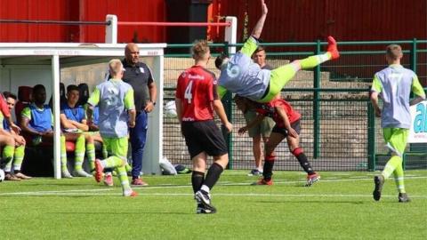 The team in their grey and green away kit