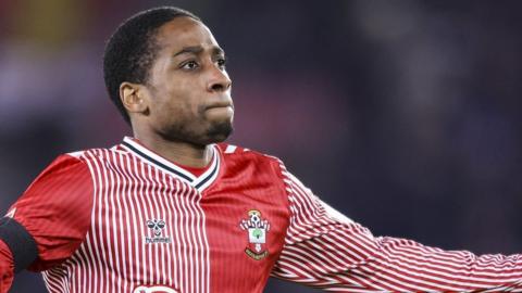 Kyle Walker-Peters runs with his arms outstretched celebrating his goal for Southampton against Bristol City