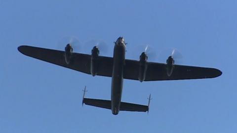 A Lancaster bomber flying over Cardiff Bay