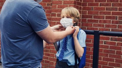 Boy wearing a mask