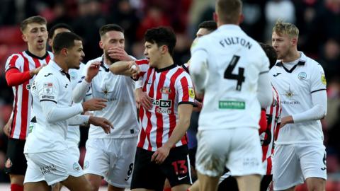 Players clash after Luke O'Nien's challenge on Ollie Cooper