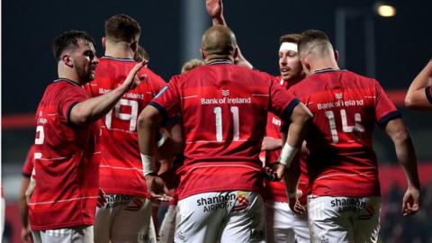 Munster players celebrate Gavin Coombes scoring a try