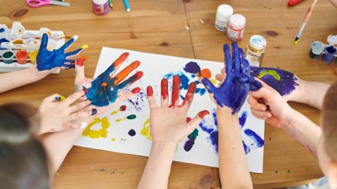 Children's painted hands