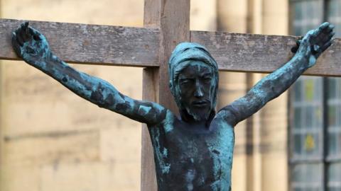 The returned and repaired bronze sculpture of Jesus