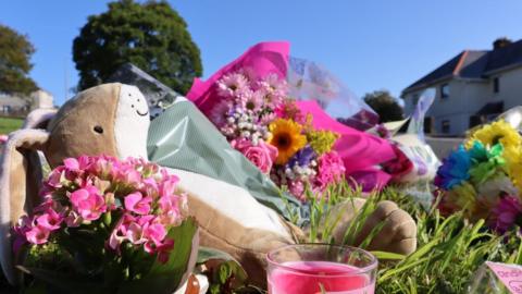 Flowers and tributes by roadside