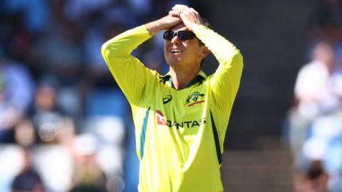 Australia bowler Adam Zampa with his head in his hands