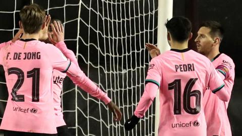 Lionel Messi and Barcelona team-mates celebrate scoring at Rayo Vallecano