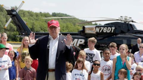 Republican presidential candidate Donald Trump in front of supporters and his helicopter