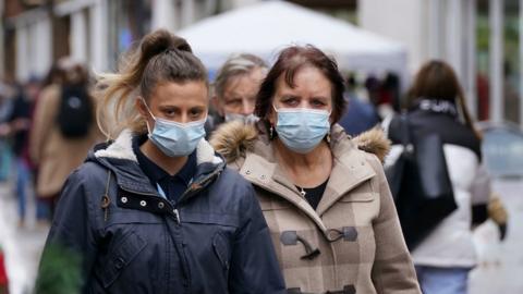 Shoppers wearning masks