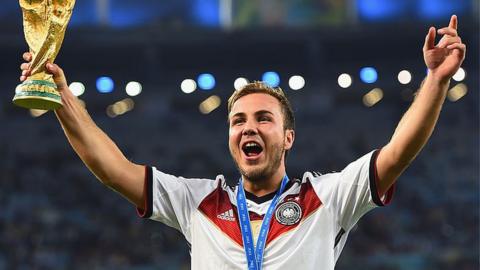 Mario Gotze lifting the World Cup for Germany