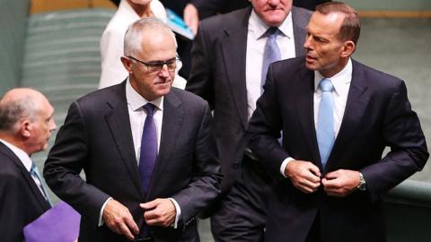 Malcolm Turnbull and Tony Abbott walk through parliament in 2015