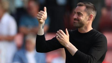 Reading boss Ruben Selles applauds fans during a League One match