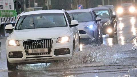 Cars on flooded road