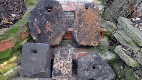 Five stone anchors found in the river