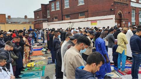 Worshippers outside the Central Masjid