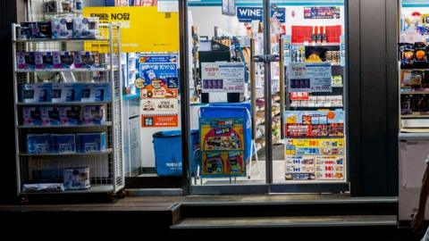 A convenience store in Seoul lit up at night on 18/08/23