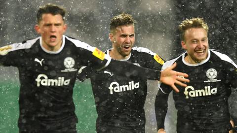 Holstein Kiel celebrate beating Bayern Munich