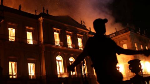 A policeman clears the area during a fire at the National Museum of Brazil in Rio de Janeiro, Brazil on 2 September2018.