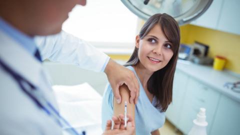 Woman being vaccinated