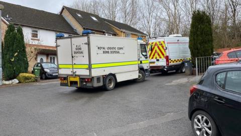 Police vans on a street