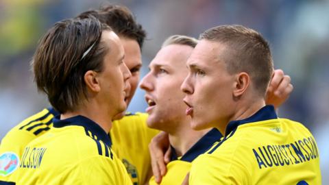 Sweden's players celebrate scoring against Poland at Euro 2020