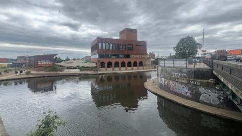 Cleaver and Wake in the Island Quarter with grey sky above