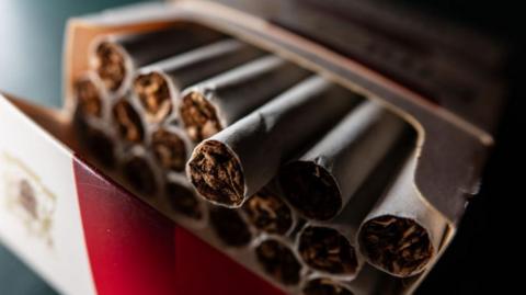 A generic image of cigarettes arranged on a table.
