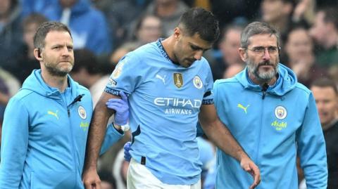 Rodri leaves the field after sustaining an injury against Arsenal