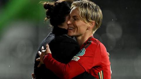 Rhian Wilkinson hugging Jess Fishlock