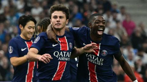 Joao Neves and Ousmane Dembele celebrate