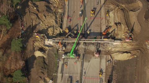 Aerial image showing a crane over a bridge