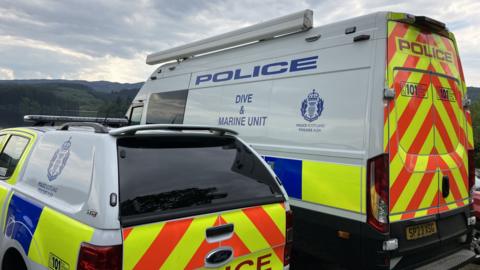 Two marine unit vans side by side