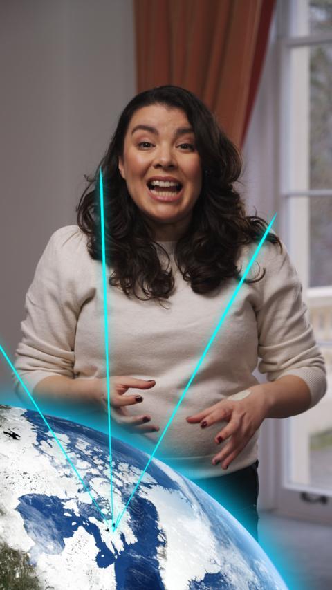 Presenter Cecilia Reed with a graphic of the Earth