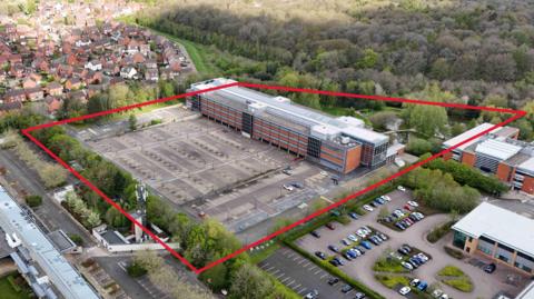 An aerial view of the former E:ON headquarters on Westwood Business Park in Coventry. A red line is drawn around the area planning to be re-developed.