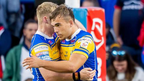 Presley Cassell (right) celebrates his try for Leeds Rhinos