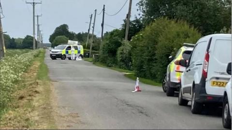 Police vehicles on a road