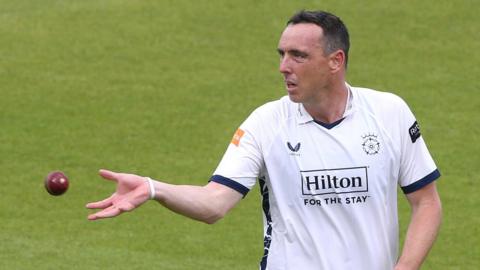 Hampshire bowler Kyle Abbott about to catch the ball before running in to bowl