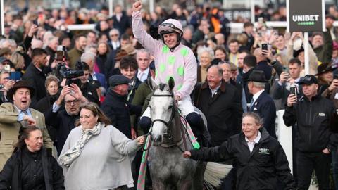 Paul Townend with his hand in the air in the Winners Enclosure with Lossiemouth