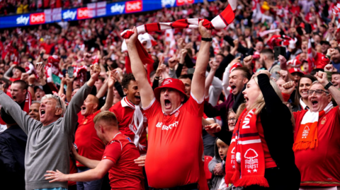 Nottingham Forest fans celebrate winning promotion to the Premier League following the Sky Bet Championship play-off final at Wembley Stadium in 2022
