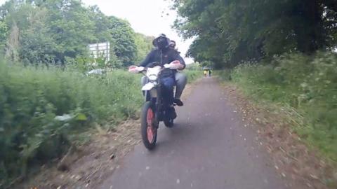 Men on a dirt bike