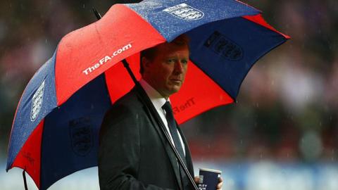 Steve McClaren sheltering under an umbrella during the Euro 2008 qualifier defeat at home to Croatia
