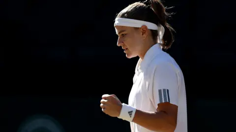 Karolina Muchova hits a forehand