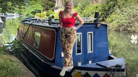 A smiling woman on a narrowboat