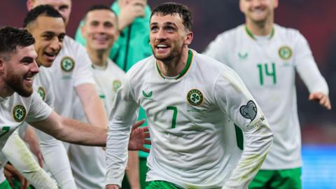 Troy Parrott celebrates completing his hat-trick