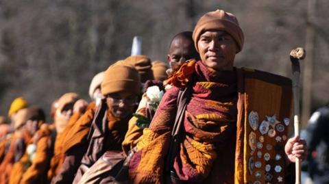 The venerable Bhikkhu Pannakara leads Buddhist monks as they continue their Walk for Peace.