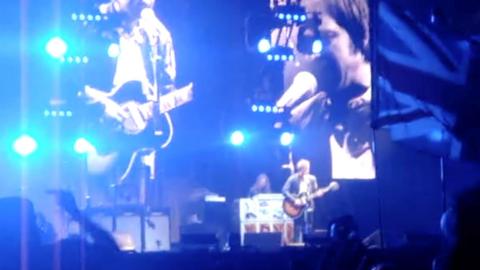 A man plays a guitar on stage