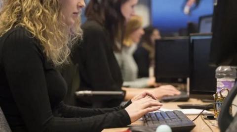 A woman working at a desk