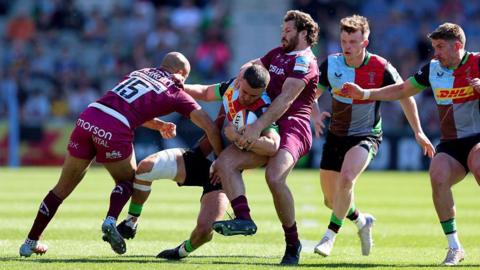 Cameron Anderson of Harlequins is tackled during the Gallagher PREM match between Harlequins and Sale Sharks.