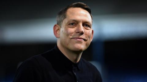 Reading boss Leam Richardson looks on from the sidelines