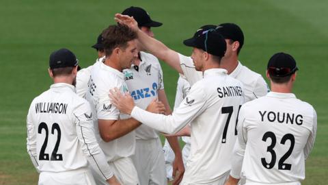 New Zealand players celebrate a wicket